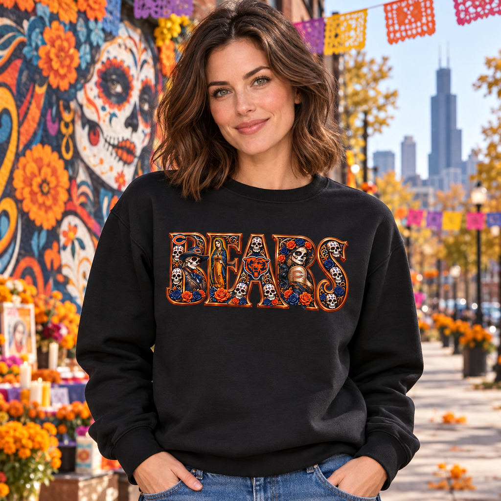 Woman wearing a black Chicago Bears Day of the Dead crewneck sweatshirt against a Chicago mural and marigold backdrop
