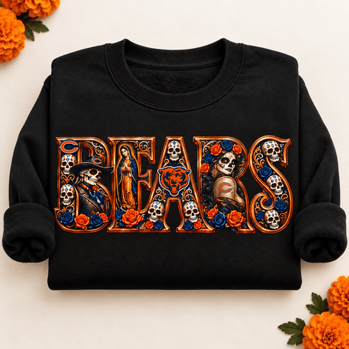 Folded black Chicago Bears Day of the Dead crewneck sweatshirt with rolled sleeves, sugar skull artwork and orange marigolds