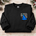 Black Bye Buddy narwhal crewneck sweatshirt folded with rolled sleeves