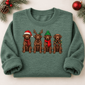 Folded heather green Chocolate Lab Christmas crewneck sweatshirt with rolled sleeves and four festive Labrador dogs