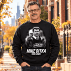 Model wearing black Coach Ditka Sweater with glasses and mustache