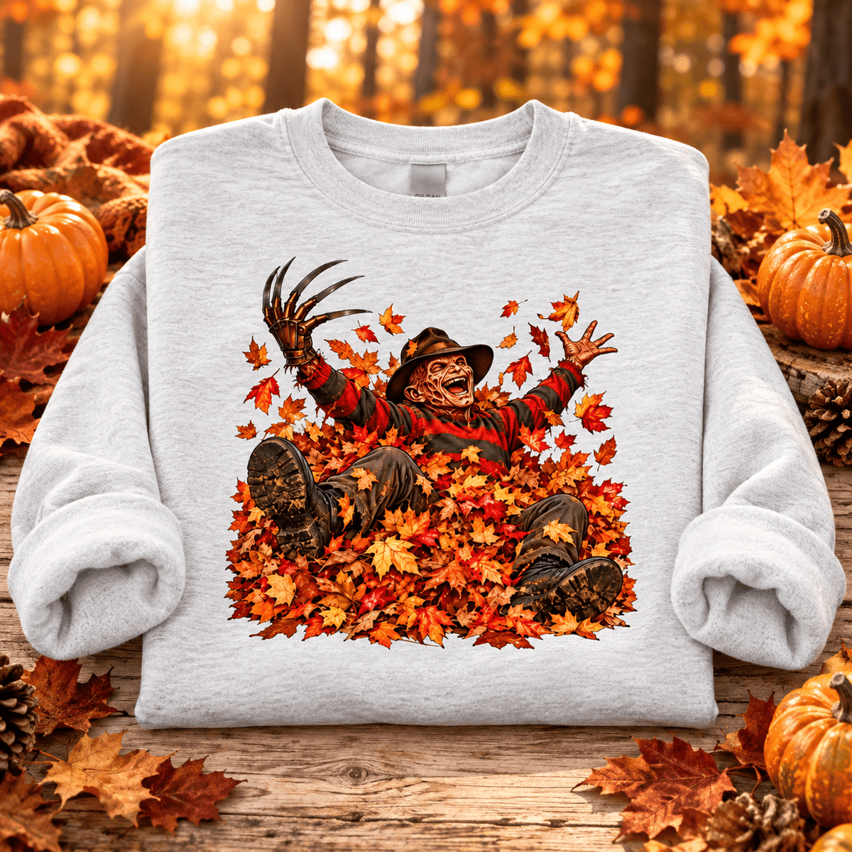 Freddy in Fall Halloween Crewneck Sweatshirt — folded Ash with rolled sleeves and themed background