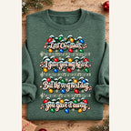 Last Christmas 2 Heather Dark Green sweatshirt folded with rolled sleeves