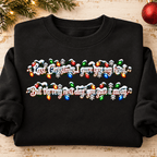 Black Last Christmas crewneck sweatshirt folded with rolled sleeves
