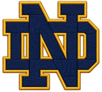 Close-up of navy-and-gold Notre Dame ND embroidery-look printed artwork