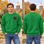 Male model with no jewelry wearing Irish Green Notre Dame Sweater with enlarged left-chest print