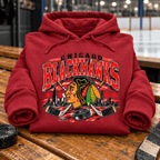 Vintage Chicago Blackhawks Hoodie — folded Antique Cherry Red with rolled sleeves and themed background