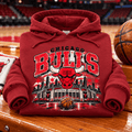 Vintage Chicago Bulls Hoodie — folded Antique Cherry Red with rolled sleeves and themed background
