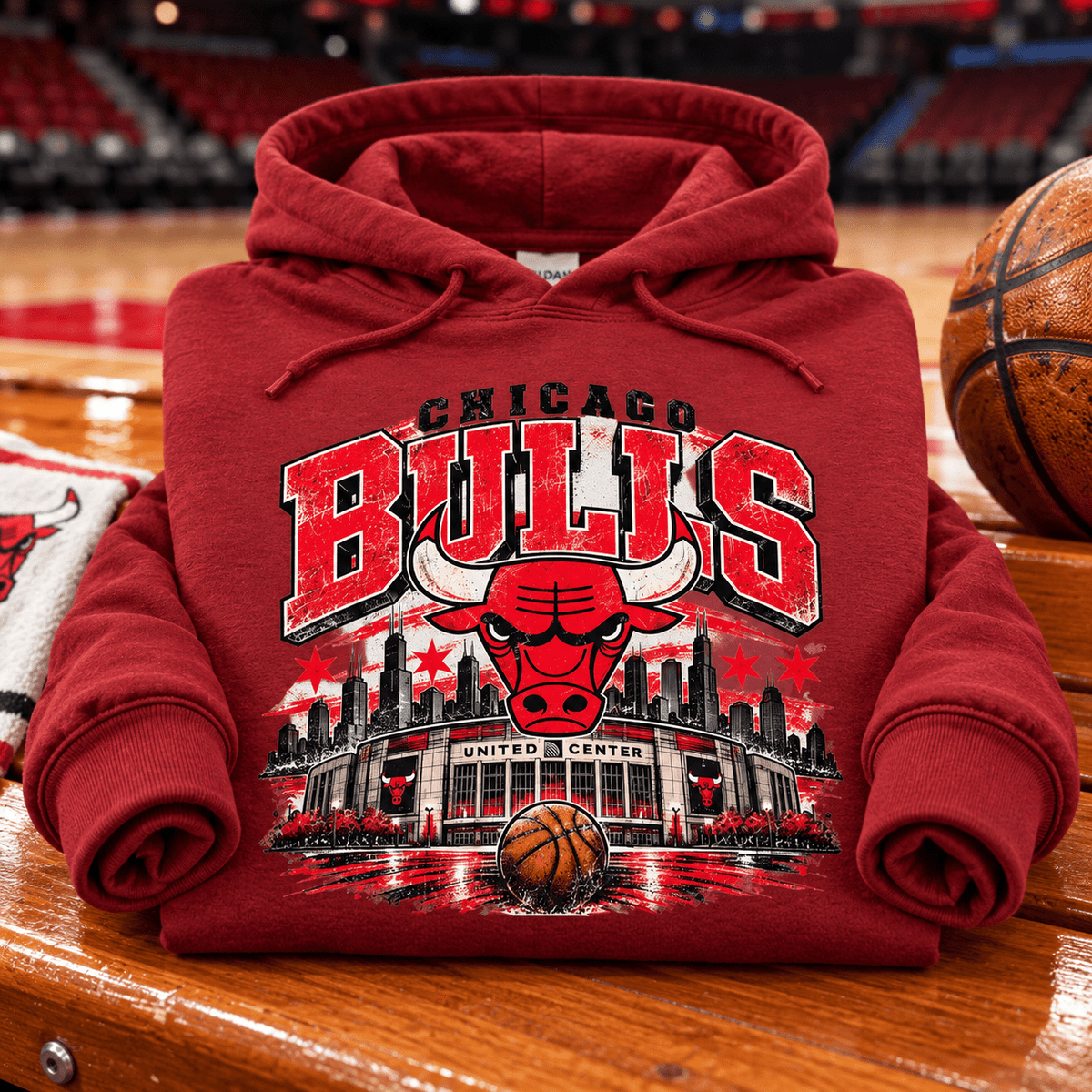 Vintage Chicago Bulls Hoodie — folded Antique Cherry Red with rolled sleeves and themed background