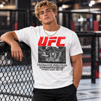 White Vintage UFC T Shirt on a blonde male model with a gold necklace in an MMA gym